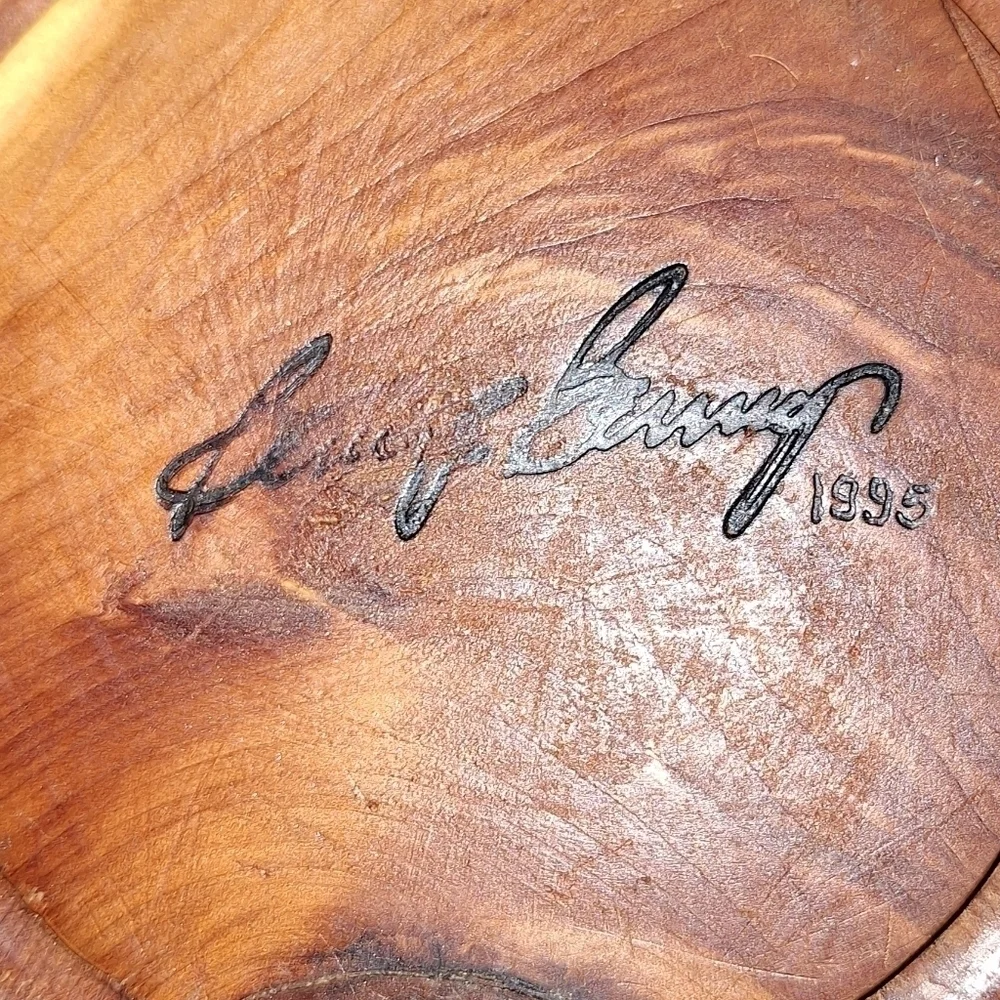 A handmade wooden bowl. It is signed, but I'm not certain of the name.